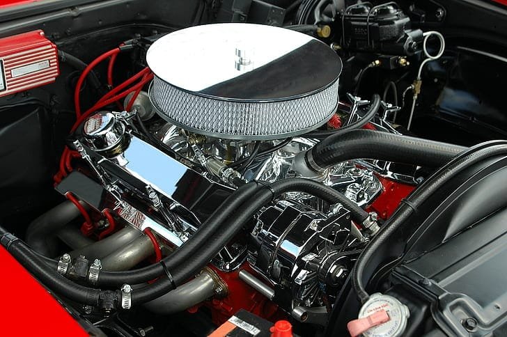 Close-up of an engine bay during inspection
